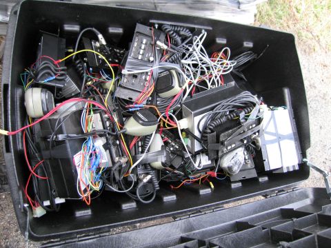 1991 Ford LTD Crown Victoria - A black case is packed with various electronic devices and a mess of colorful wires.