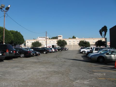 1968 Ford Mustang - A parking lot filled with various vehicles on a sunny day.