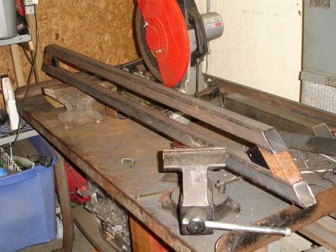 1989 Ford Bronco - Metal sliders are being worked on in a workshop setting.