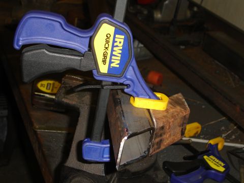 1989 Ford Bronco - Metal tubing secured by an Irwin Quick-Grip clamp during a project.