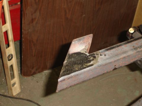 1989 Ford Bronco - A metal bracket is shown with a level and a wooden surface in the background.