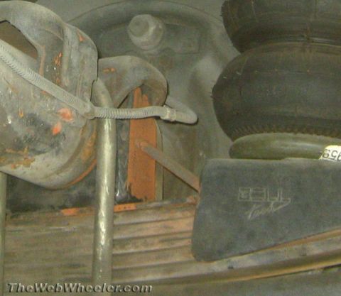 1994 Chevrolet Silverado 3500 - Close-up view of suspension parts, including air bellows and leaf springs.