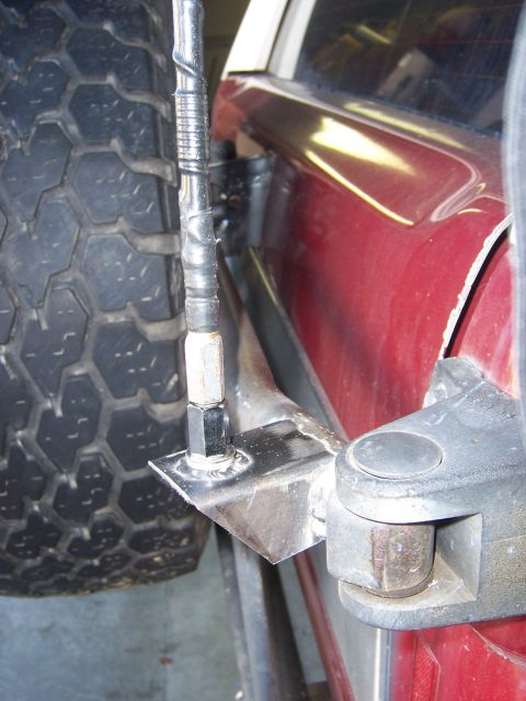 1991 Ford Bronco - Custom CB antenna mount attached to the spare tire carrier of a 1991 Ford Bronco.