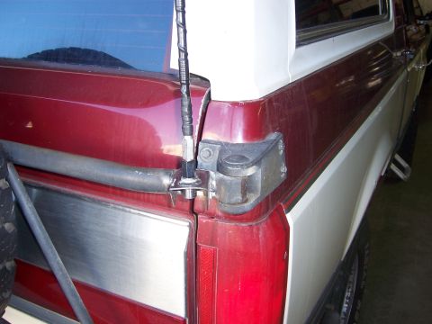 1991 Ford Bronco - Rear view of a 1991 Ford Bronco, highlighting the antenna mount on the tailgate.