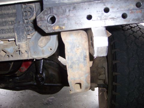 1991 Ford Bronco - Close-up view of custom front bumper fabrication, showing mounting brackets, radiator, and tire.