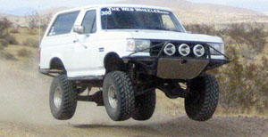 1968 Ford Mustang - This modified SUV is captured mid-air during an off-road excursion.
