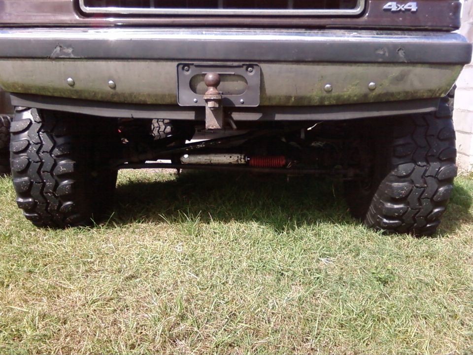 rear bumper, hitch, and large tires of an off-road SUV