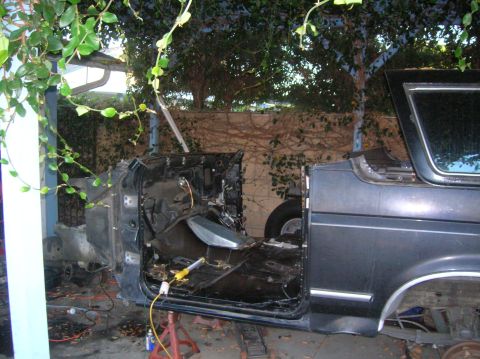 1985 Ford Bronco - The interior of a vehicle is exposed and appears to be undergoing repairs or restoration.