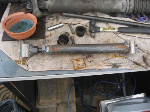1990 Ford F-250 - Custom adjustable control arm assembly with tools and hardware laid out for installation.