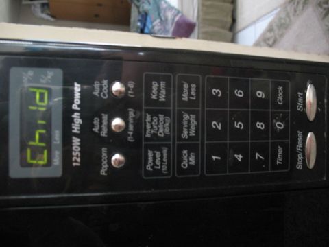 1997 Ford Crown Victoria - Control panel of a microwave oven displays 'Child' mode and various cooking options.