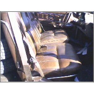 1973 Ford Ranchero - Interior view of brown leather seats and dashboard, likely from a classic vehicle.