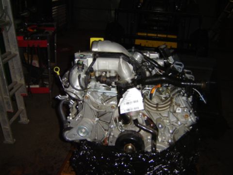 1992 Ford Bronco - Engine assembly with a white tag attached, likely for identification or sale.