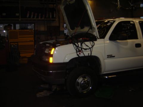 1992 Ford Bronco - White pickup truck in a garage with hood open, engine wiring exposed.