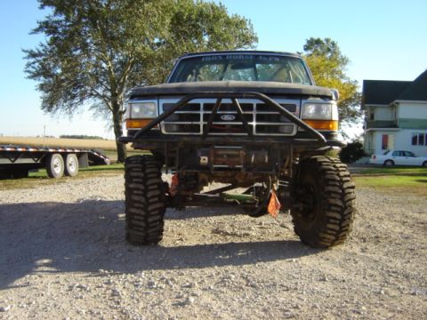 1992 Ford Bronco - Modified 1992 Ford Bronco with custom front bumper and large tires.