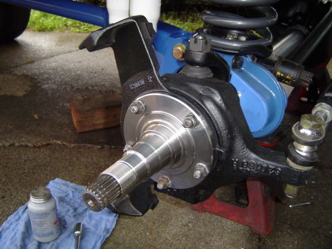 1978 Ford Bronco - A vehicle's suspension system is shown with a focus on the hub and steering knuckle assembly.