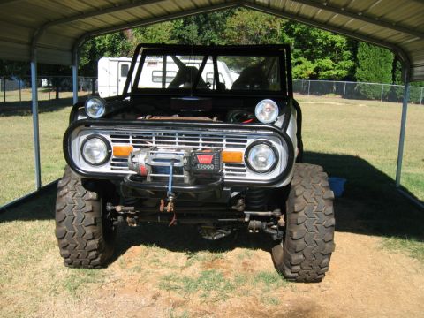 1992 Ford Mustang - This modified Ford Bronco features a winch and off-road tires, suggesting it is built for terrain.