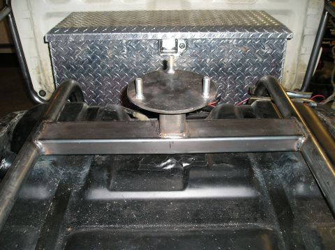 1986 Toyota Hilux - Custom fabricated spare tire mount and toolbox installed in the bed of a pickup truck.