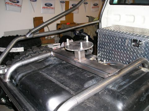 1986 Toyota Hilux - Custom roll cage and fuel tank installation in a truck bed.