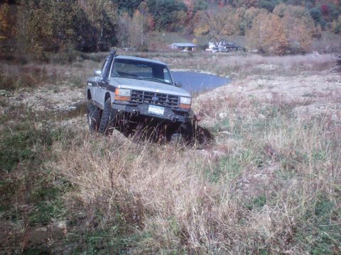 1990 Ford Ranger - Ford Ranger pickup truck navigating rough terrain with a snorkel installed.