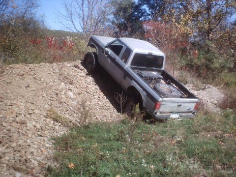 1990 Ford Ranger - This lifted 1990 Ford Ranger navigates a steep dirt embankment, its off-road capabilities.