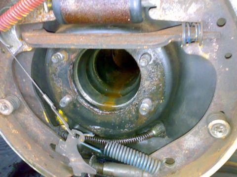 1995 Ford F-150 - Close-up view of a vehicle's brake drum assembly, showing internal components and rust.