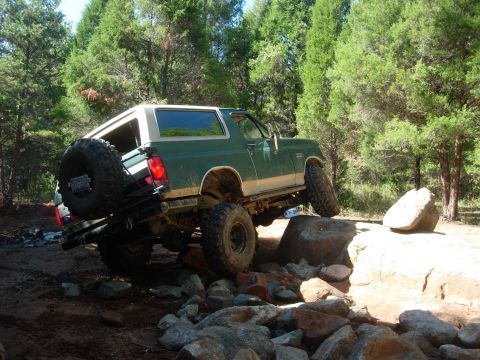 1995 Ford Bronco - This 1995 Ford Bronco navigates a challenging rocky terrain on an off-road trail.