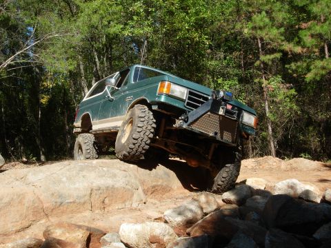 1995 Ford Bronco - This lifted 1995 Ford Bronco navigates a rocky off-road course, its capabilities.