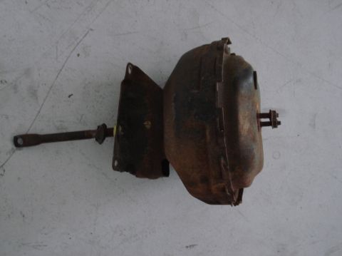 1979 Chevrolet C/K Pickup - This rusty brake booster assembly is a component from a vehicle, not a complete car.