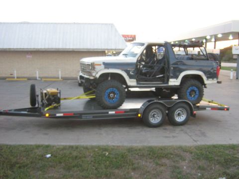 1986 Ford Bronco - This modified Ford Bronco is being transported on a trailer.