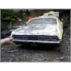 1971 Mercury Cyclone - Rear view of a 1971 Mercury Cyclone GT, showing its distinctive taillights and weathered condition.