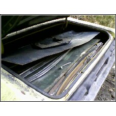 1971 Mercury Cyclone - The trunk of a car is shown, packed with disassembled parts and panels.