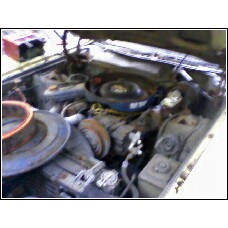 1971 Mercury Cyclone - Close-up view of a cluttered engine bay with visible engine components and a prominent watermark.
