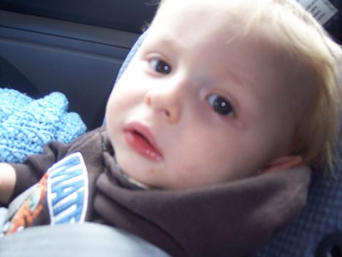 1972 Ford Ranchero - A baby is seen in close-up, with a blue blanket and part of a shirt visible.