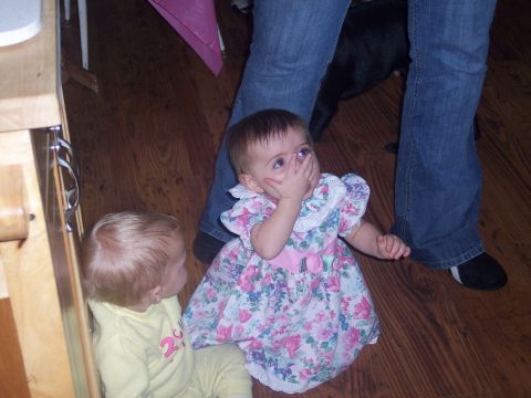 1972 Ford Ranchero - Two young children are on a wooden floor, with an adult's legs visible in the background.