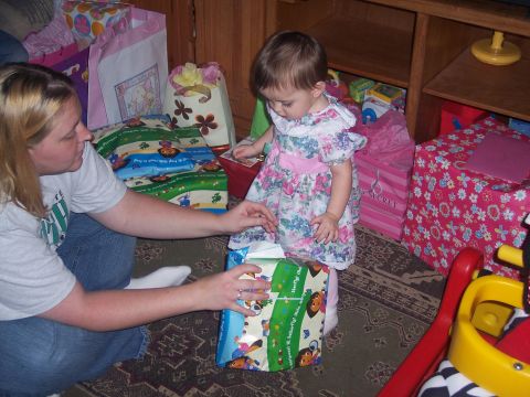 1972 Ford Ranchero - A woman and a baby are opening presents on the floor surrounded by gift bags.