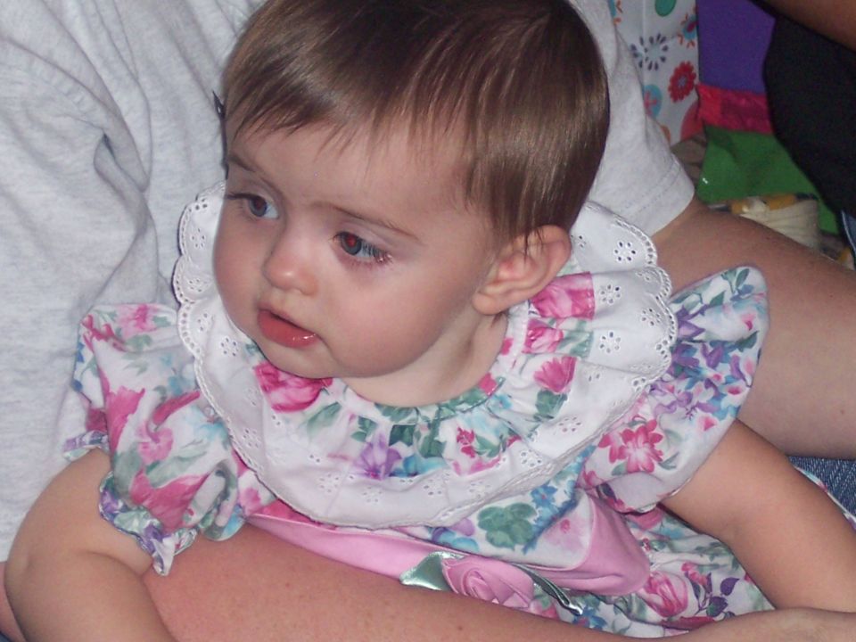 Baby in floral dress with white collar