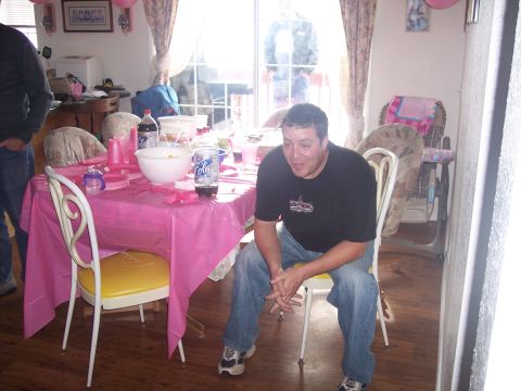 1972 Ford Ranchero - A group of people are seen at a party, with a table covered in a pink tablecloth and decorated with balloons.