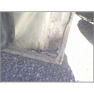 1972 Ford Ranchero - Detail of a vehicle's door frame showing signs of wear and corrosion, with a SuperMotors logo at the bottom.