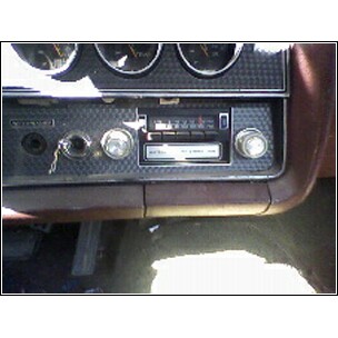 1972 Ford Ranchero - Close-up of a car's dashboard, showing the radio and instrument cluster.