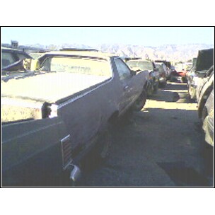 1972 Ford Ranchero - This vehicle is in a junkyard with other cars.