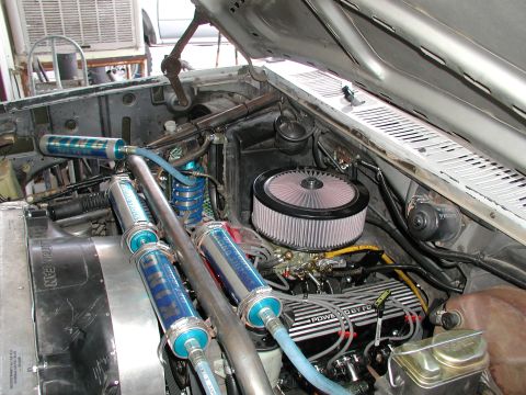 1980 Ford Bronco - The engine bay features a V8 engine with a custom nitrous oxide system and performance air intake.