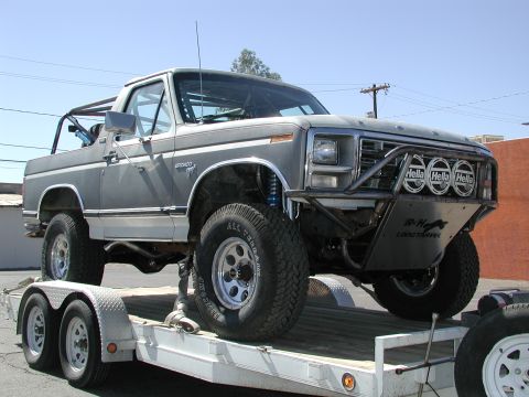 1980 Ford Bronco - Customized 1980 Ford Bronco being transported on a dual-axle trailer.