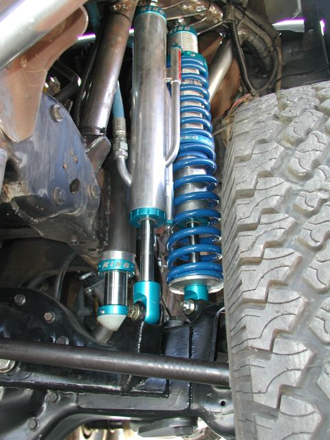 1980 Ford Bronco - Custom suspension components, including King shocks, are visible on a vehicle's undercarriage.