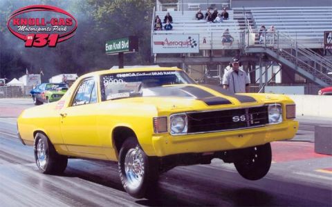 1971 Ford Ranchero - A yellow 1971 Ford Ranchero SS performs a wheelie during a drag race at Knoll-Gas Motorsports Park.