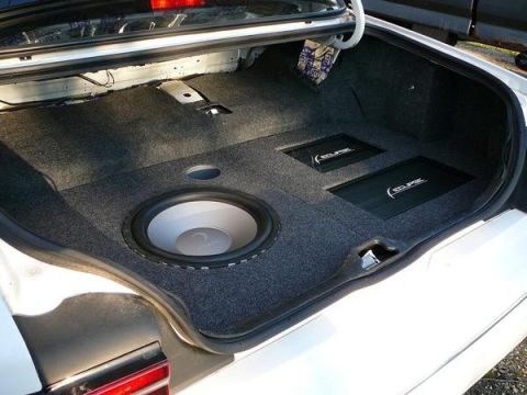 1997 Mercury Grand Marquis - Custom car trunk audio setup a large subwoofer and dual Eclipse amplifiers.