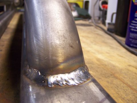 1991 Ford Bronco - Close-up of a metal tube with welds, suggesting fabrication work.