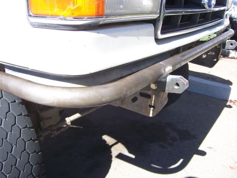 1991 Ford Bronco - Custom fabricated front bumper and tow hitch on a white truck, likely from the early 1990s.