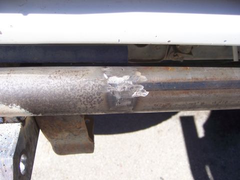 1991 Ford Bronco - This close-up shows a metal tube with recent welding marks, indicating a repair or modification.