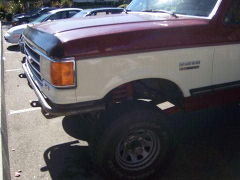 1991 Ford Bronco - The visible body style and badging suggest a 1992 Ford Bronco, not a 1991 model.