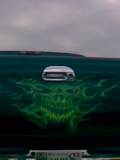 1994 Ford Bronco - Custom airbrushed skull and flames adorn the rear of this vehicle.
